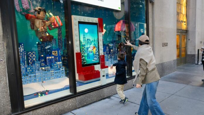 mum and child looking at window display