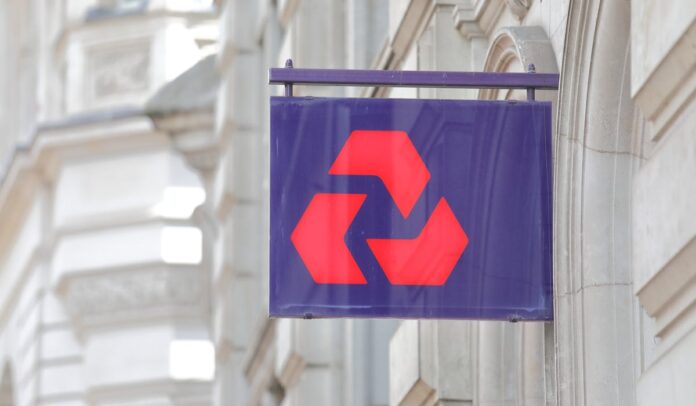 red on blue signage on wall