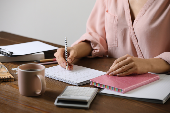 Women working on her schedule for her personal conceirge business.png